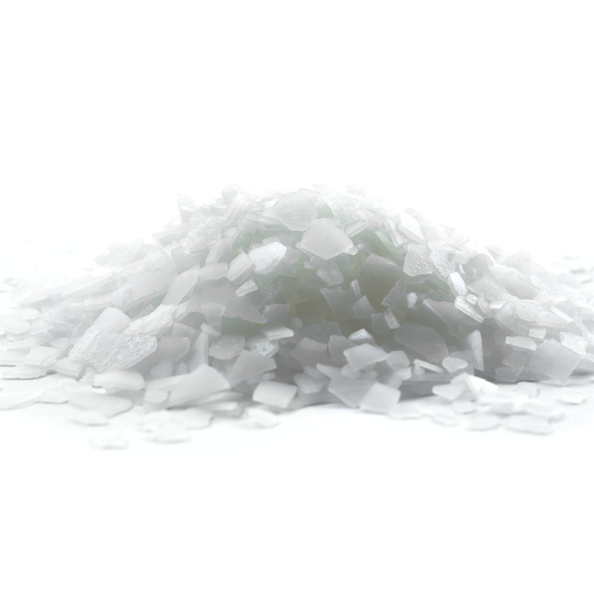 Zechstein magnesium flakes, on white surface